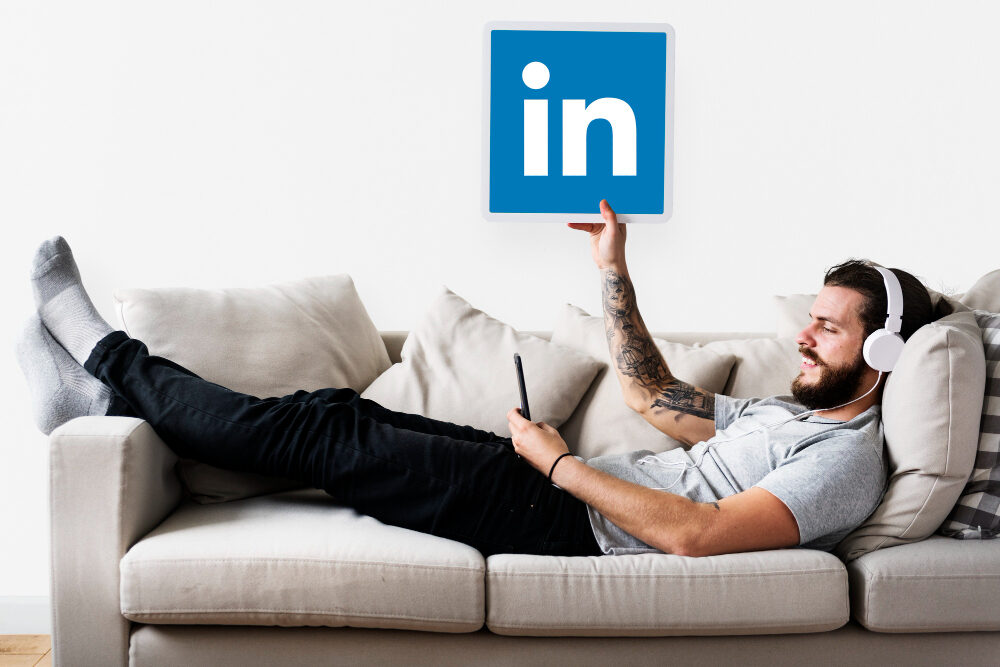 person-holding-linkedin-icon